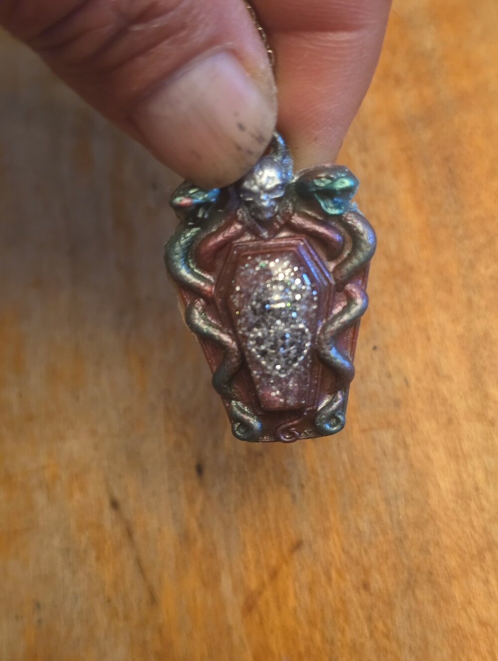 Snake Guarded Glitter center Over Heart Of The Coffin On A Silvrr-tone Chain